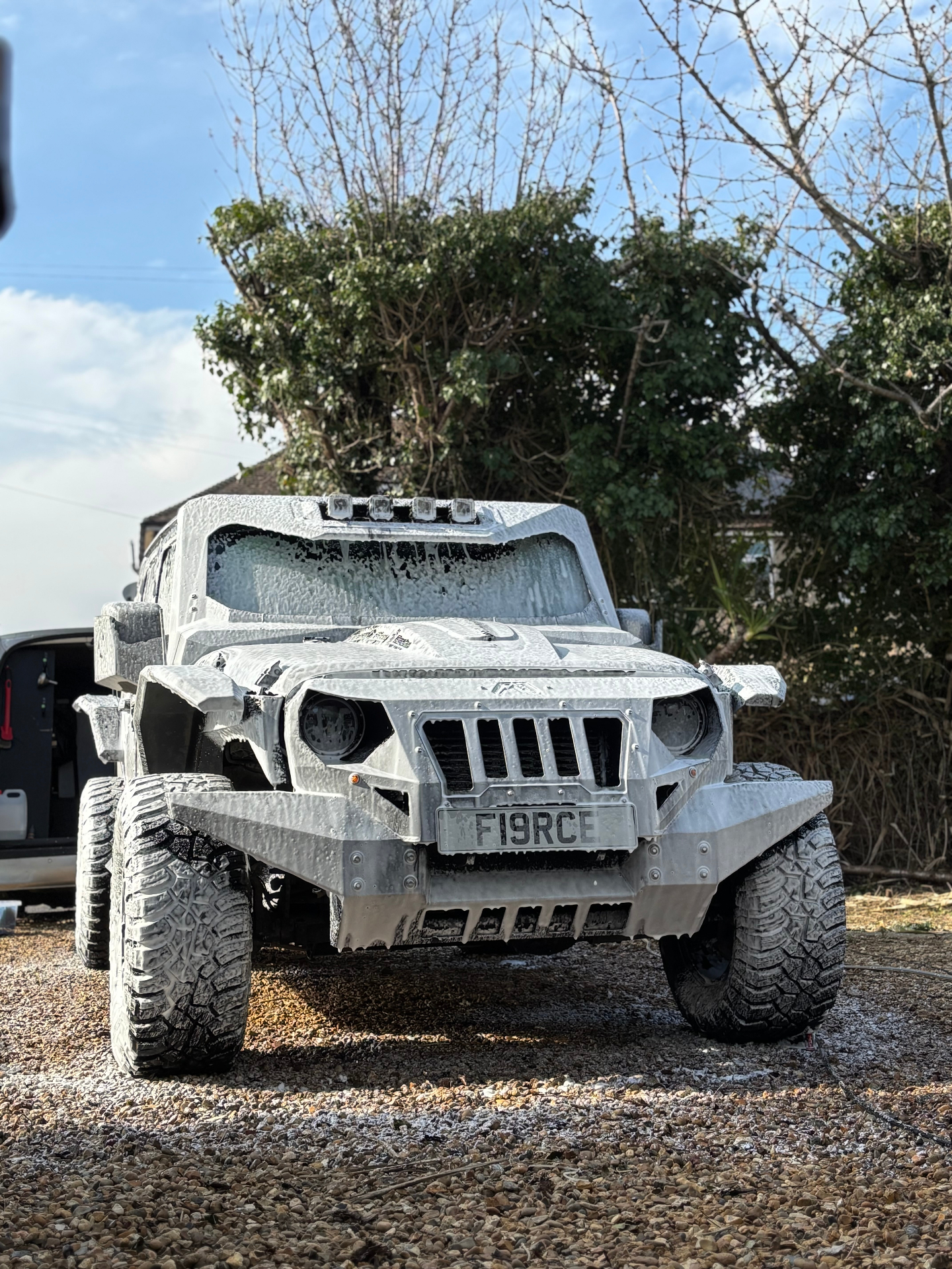 Jeep covered in foam - Saints Valet & Detailing